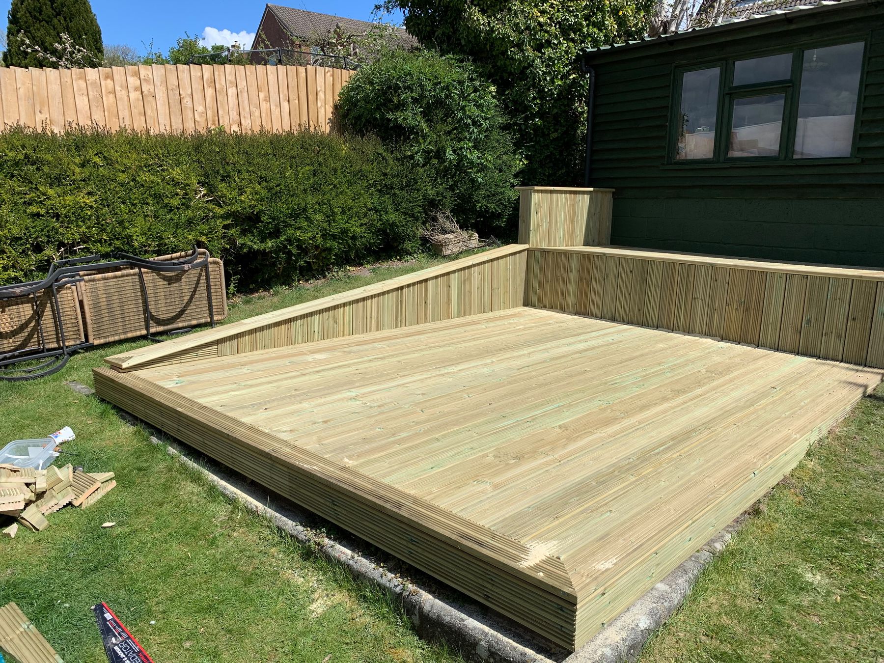 Raised timber decking with integrated bench